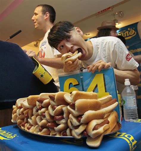 asian hot dog eating champion|Competitive eater and six.